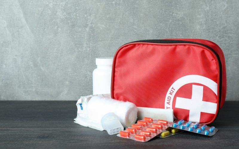 first-aid-medical-kit-dark-wooden-table